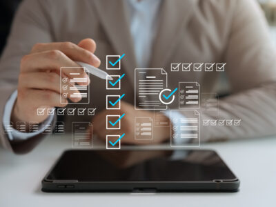checklist infographic overlays man with laptop