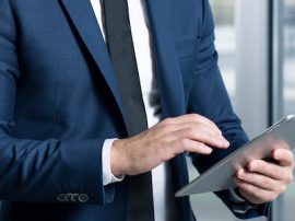 Businessman in suit using tablet Businessman in suit using tablet